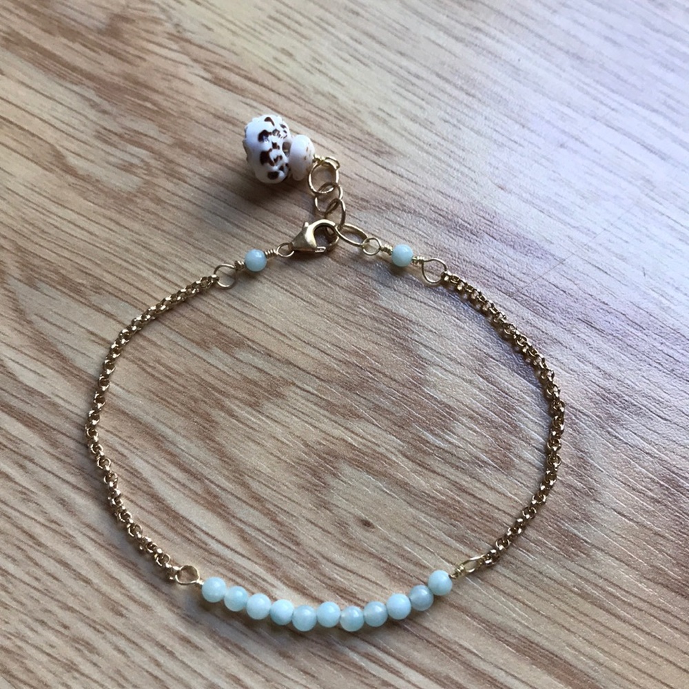 Gold filled bracelet with green beads and shells